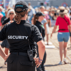 A woman wearing a security uniform.